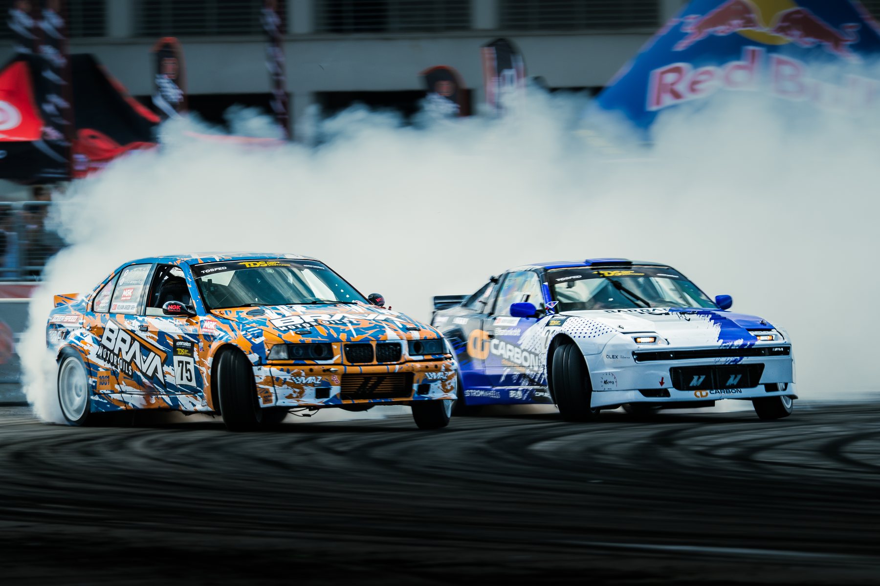 Brava-liveried drift car twinned door-to-door on track